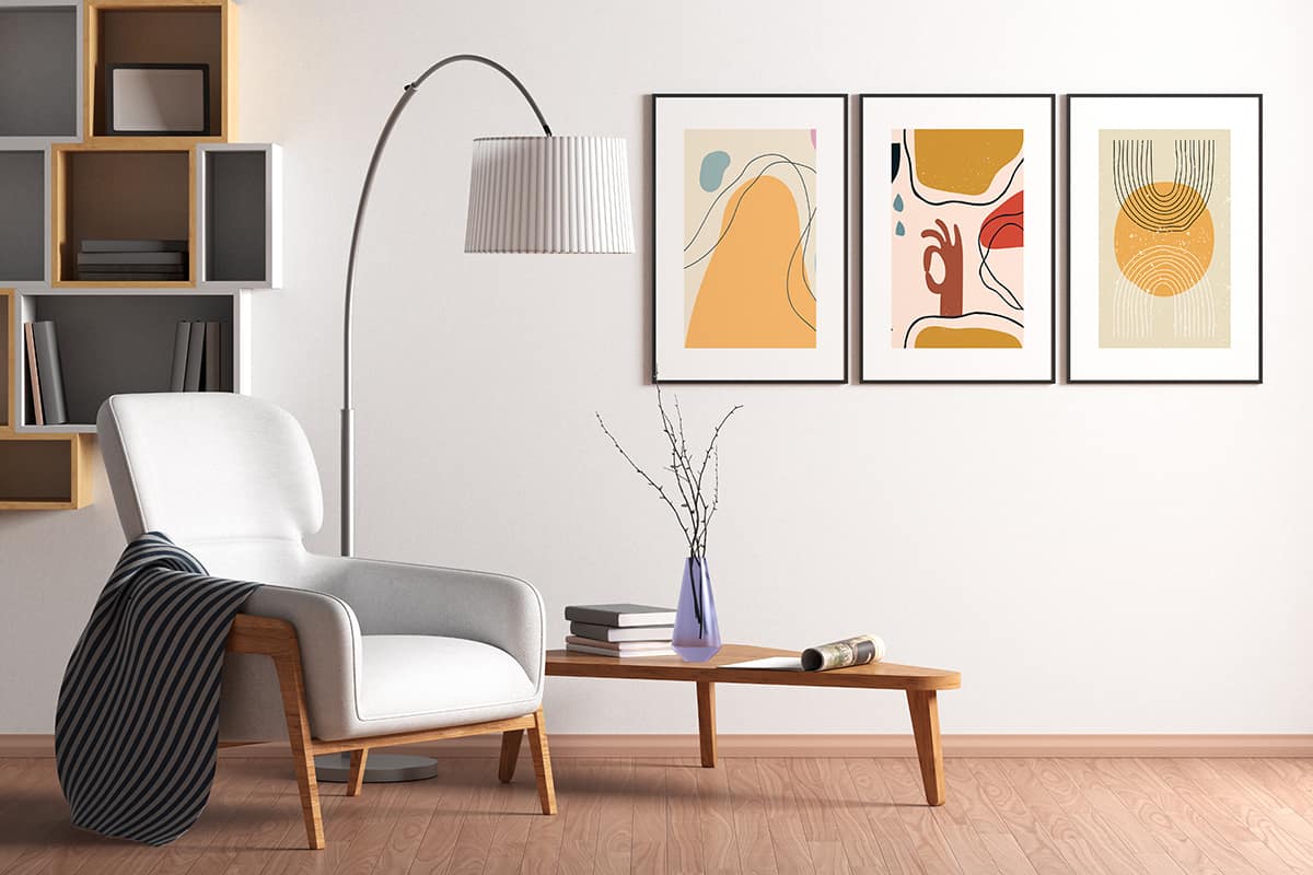 Blank poster mock up with black frame on the wall in living room interior